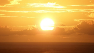 Sunset sky clouds boat ocean - a sunset free wallpaper