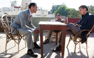 Two men talking courtyard table - international typographic style free wallpaper