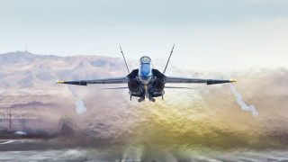 Jet over water mountains smoke - over a body of water free wallpaper