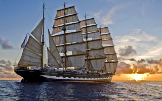 Sailboat ocean sunset clouds city - sunset free wallpaper