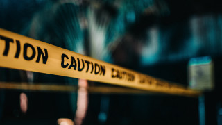 Caution sign blurry building tree - anamorphic free wallpaper