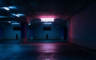 Dark parking garage neon sign - cyberpunk art free wallpaper