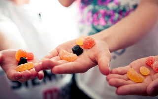 Jellybeans black object closeup blurry - a person holding free wallpaper