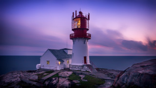 Lighthouse rocky shore purple sky - a rocky shore free wallpaper