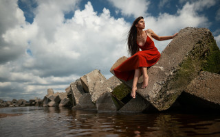 Woman red dress sitting rock 4 - a red dress free wallpaper for desktop