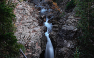 Waterfall rocky mountain river forest - a few leaf free wallpaper