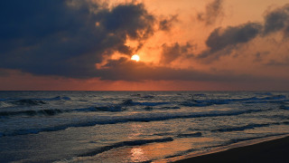 Sunset ocean waves beach surfboard - a surfboard free wallpaper