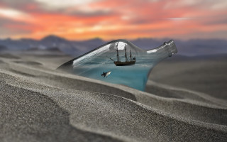 Bottle ship ocean sunset bird - a sunset in the background and a bird free wallpaper