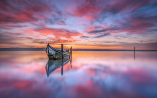 Boat water sunset dock mystical - a pink sky in the background free wallpaper for desktop