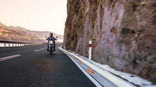 Motorcycle rider cliff water mountains - canon eos r 3 free wallpaper