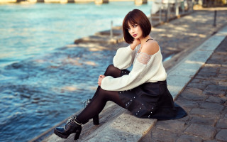Woman sitting water white sweater - a ledge next free wallpaper