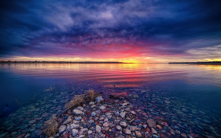 Sunset water rocks cloudy sky - mystical free wallpaper