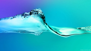 Blue green water wave building - the foreground and a building in the background free wallpaper