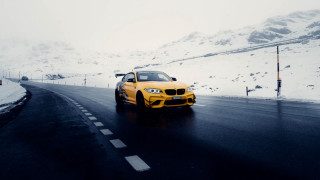 Yellow car snowy mountain europe - a snow free wallpaper