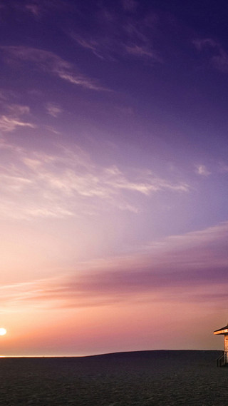 Beach hut sunset purple sky - the sand free wallpaper