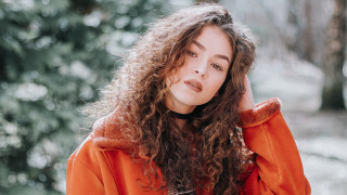 Woman curlyhair orangejacket woods portrait - curly hair free wallpaper