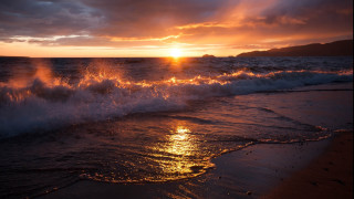 Sunset ocean waves mountain clouds 2 - a sunset over the ocean free wallpaper