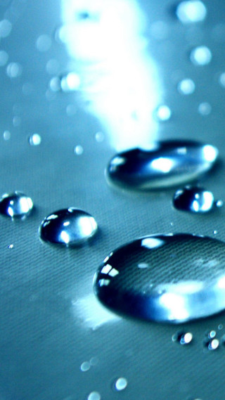 Water droplets closeup blue background - water free wallpaper