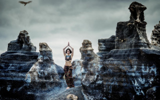 Woman rock bird aurora sky - over her head free wallpaper