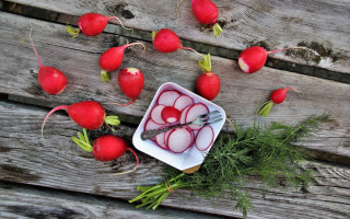 Radishes knife wooden table stilllife - a wooden table free wallpaper