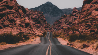 Mountain road car autumn leaves - a car free wallpaper