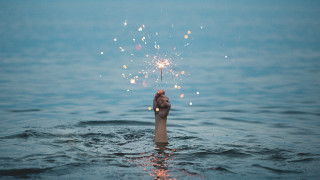 Hand sparkler water sky beach - florianne becker free wallpaper