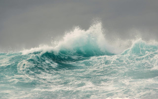 Large wave breaking ocean cloudy 2 - a surfboard free wallpaper