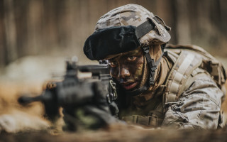 Soldier crouching camouflage gun grass - a soldier free wallpaper