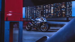 Motorcycle parking lot night neon - the side of the building free wallpaper