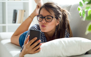 Woman couch phone pillow bookcase - text free wallpaper
