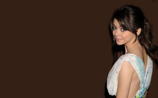 Woman smiling dress brown background - grey background free wallpaper