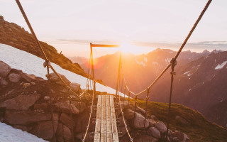 Suspension bridge mountains sunset limital - a view of the mountains free wallpaper