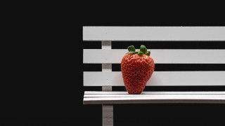 Strawberry white bench black background - vertical stripe free wallpaper