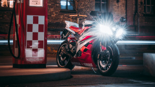 Red motorcycle gas pump cityscape - a red motorcycle free wallpaper