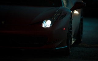 Red sports car headlights on - the front of the car free wallpaper