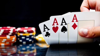 Hand playingcard pokerchips table blackbackground - a hand holding free wallpaper