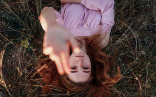 Girl hair blowing onground outdoors - the wind free wallpaper