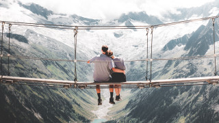 Suspension bridge man mountains hands - his head in his hands free wallpaper