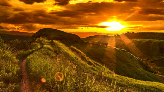 Sunset grassy hill path mountain 2 - a mountain in the distance free wallpaper