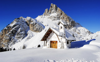 Small church snowy mountain range - small free wallpaper