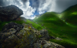 Green mountain rock formation cloudy - a green mountain free wallpaper