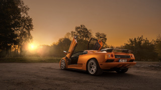 Yellow sports car dirt road 2 - a yellow sports car free wallpaper