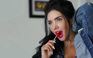 Woman denim jacket lollipop smile - a toothbrush free wallpaper