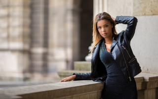 Woman leaning wall serious brown - a wall free wallpaper