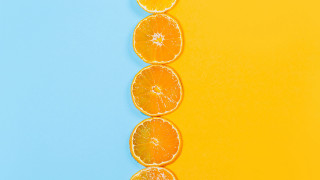 Orange slices yellow blue background - a blue border free wallpaper