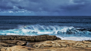 Wave crashing ocean cloudy rainbow - a cloudy day free wallpaper