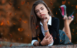 Woman brick wall cellphone autumn - a brick wall free wallpaper