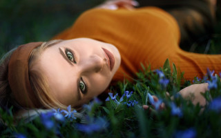 Woman lying flower field blue - wide free wallpaper