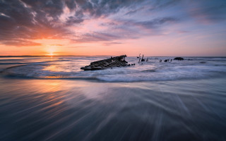 Boat shore sunset water mountain - wave free wallpaper