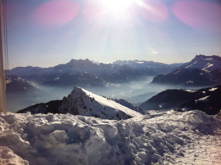 Mountain range snow sunset cloudy - a view of a mountain range free wallpaper